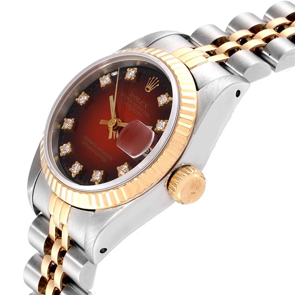 This image shows a side angle of a Rolex Datejust 69173 Women's Stainless Steel Red Dial 69173 Women's Stainless Steel Red Dial watch, highlighting the dial, crown, bezel, and part of the bracelet.