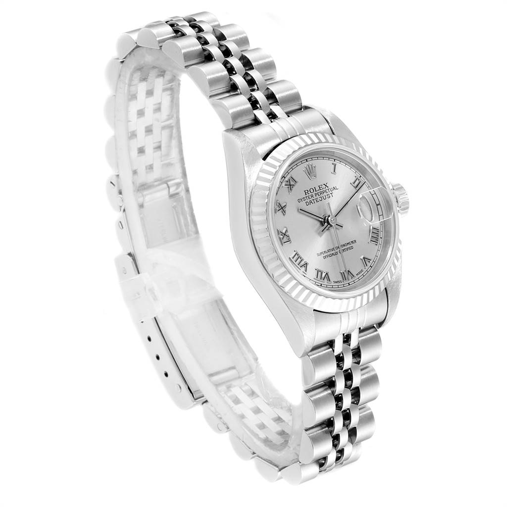 The image shows a side and top view of the Rolex Datejust 79174 Women
s Stainless Steel Silver Dial 79174 Women
s Stainless Steel Silver Dial model, displaying its face and jubilee bracelet.