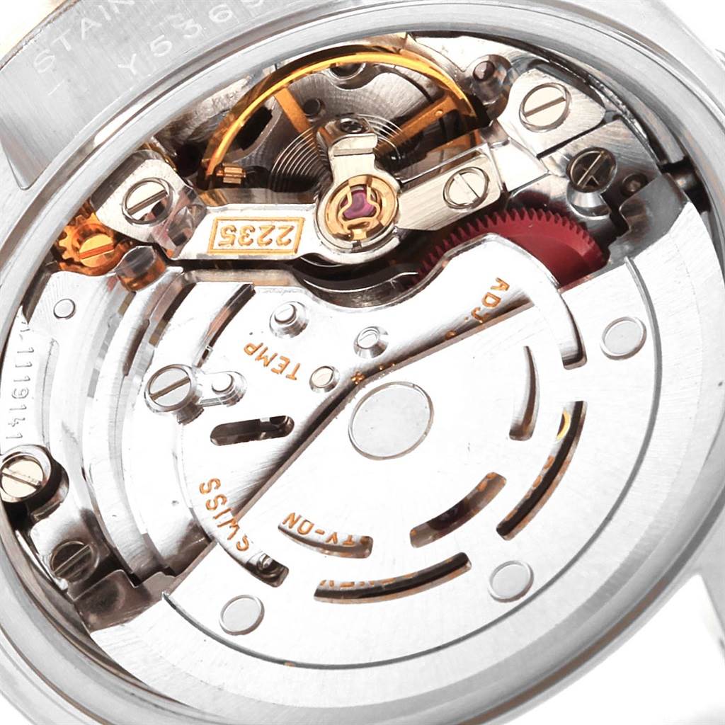 This image shows a close-up view of the intricate movement and inner workings of a Rolex Datejust 79174 Women
s Stainless Steel Black Dial 79174 Women
s Stainless Steel Black Dial watch.