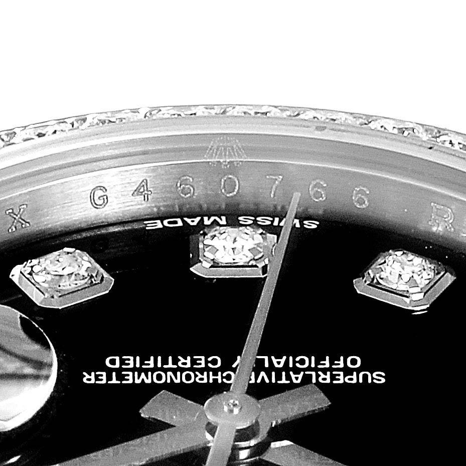 This image shows a close-up of a Rolex Datejust 179384 Women
s Stainless Steel Black Dial 179384 Women
s Stainless Steel Black Dial watch dial and bezel, focusing on the serial number and diamond markers.
