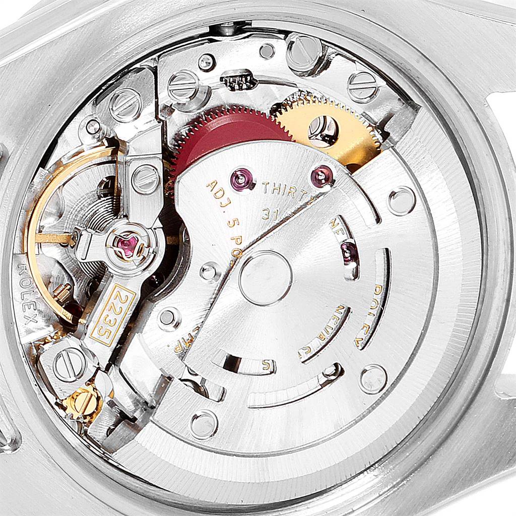 This image shows the internal mechanism of a Rolex Datejust 179384 Women
s Stainless Steel Black Dial 179384 Women
s Stainless Steel Black Dial watch, highlighting gears and the movement components.