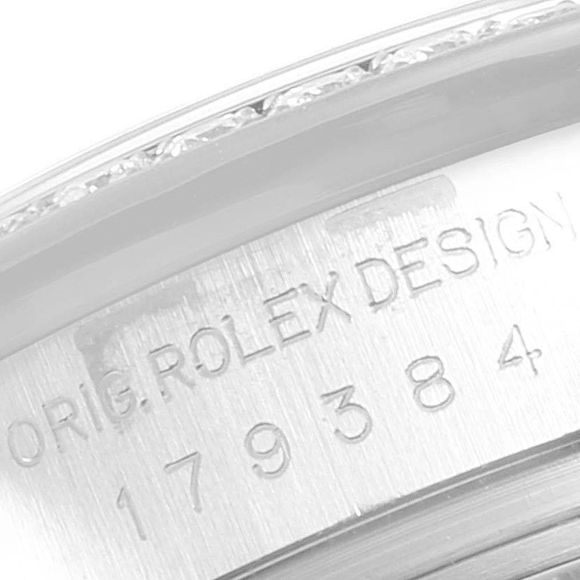 This image shows the engraved case back of a Rolex Datejust 179384 Women
s Stainless Steel Mother of Pearl Dial 179384 Women
s Stainless Steel Mother of Pearl Dial watch, focusing on the model number and "ROLEX DESIGN" text.