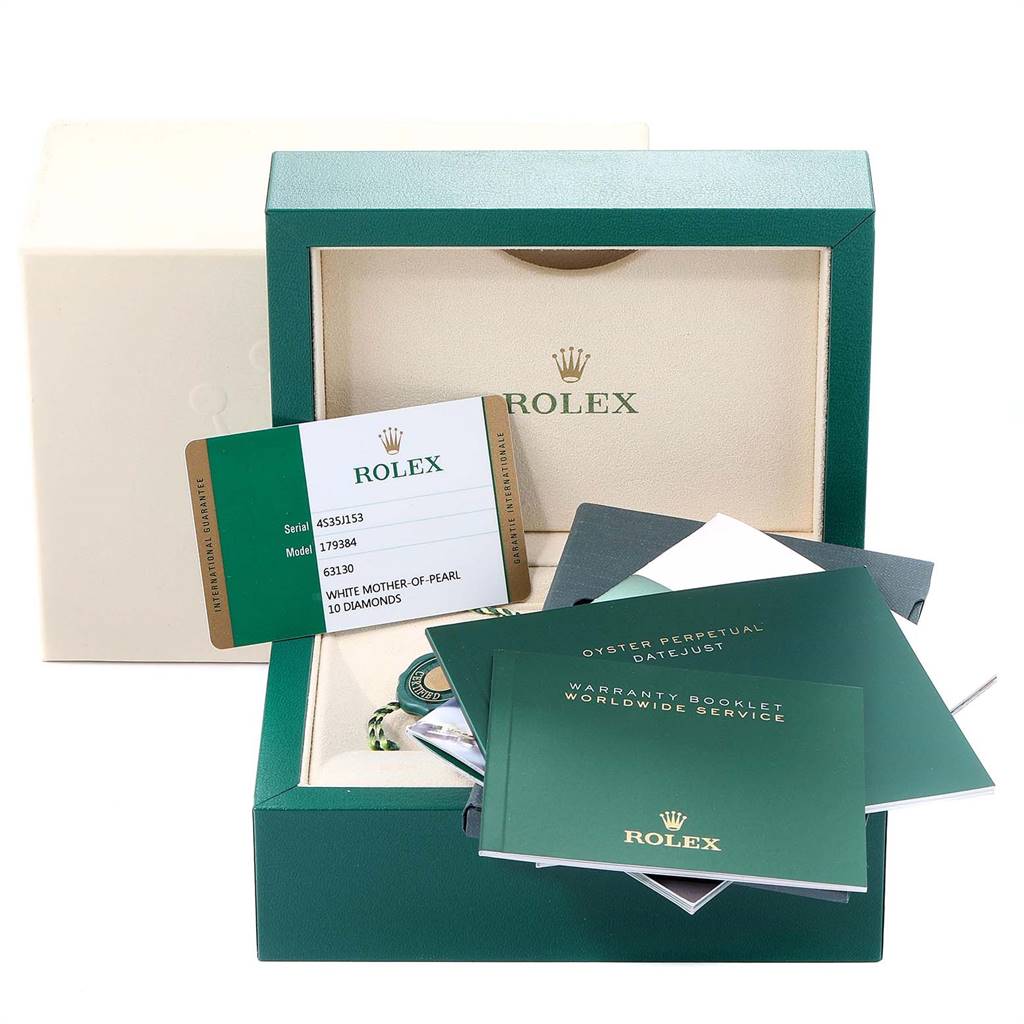 The image shows the packaging, warranty card, and booklets for a Rolex Datejust 179384 Women
s Stainless Steel Mother of Pearl Dial 179384 Women
s Stainless Steel Mother of Pearl Dial model.
