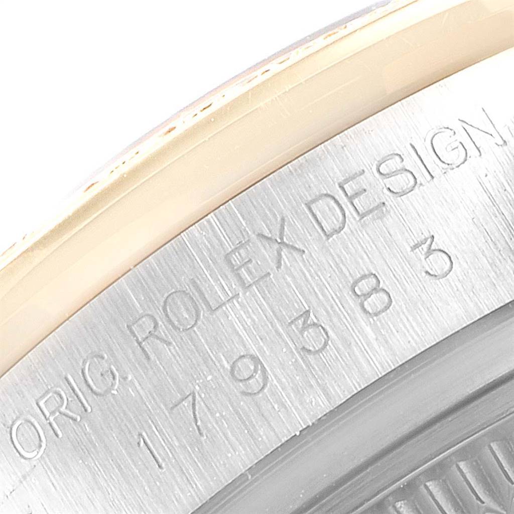 This close-up image shows the side view of the case with engravings on the Rolex Datejust 179383 Women
s Steel and Gold (two tone) Mother of Pearl Dial 179383 Women
s Steel and Gold (two tone) Mother of Pearl Dial watch.