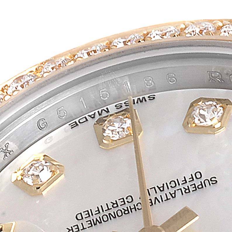 This image shows a close-up of a Rolex Datejust 179383 Women
s Steel and Gold (two tone) Mother of Pearl Dial 179383 Women
s Steel and Gold (two tone) Mother of Pearl Dial watch face, highlighting diamond hour markers and part of the bezel.