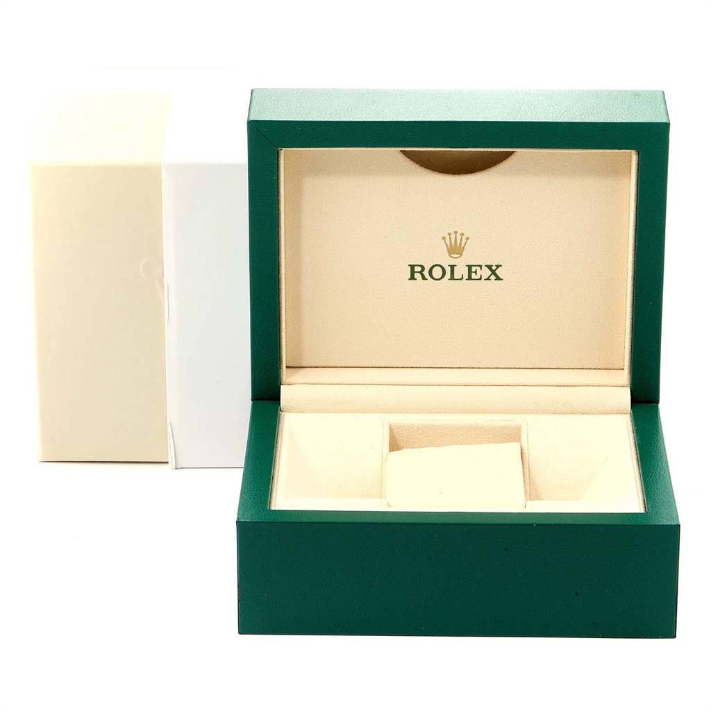This image shows an open green Rolex watch box for the Datejust model, without the watch, revealing its interior compartments.