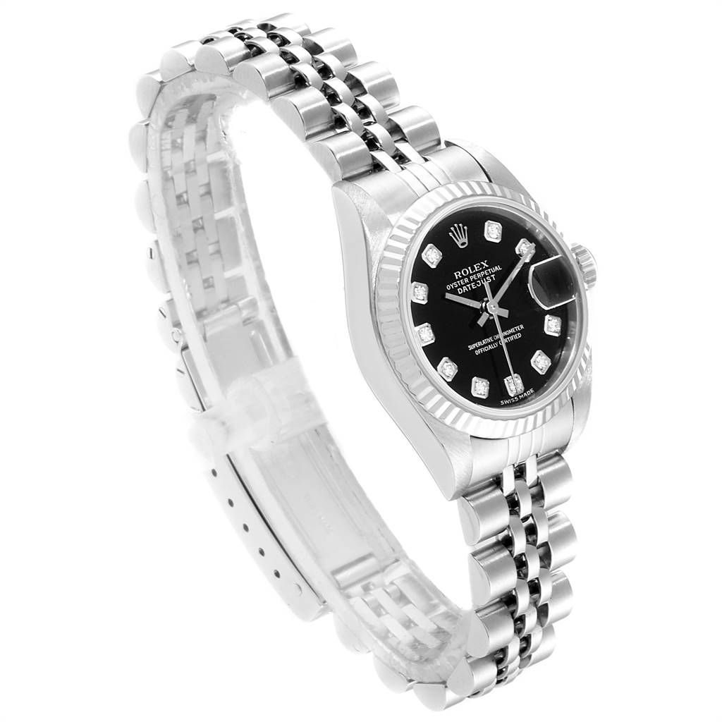 The image shows a Rolex Datejust 79174 Women
s Stainless Steel Black Dial 79174 Women
s Stainless Steel Black Dial watch from a three-quarter angle, highlighting the bracelet, case, and black dial with diamond markers.