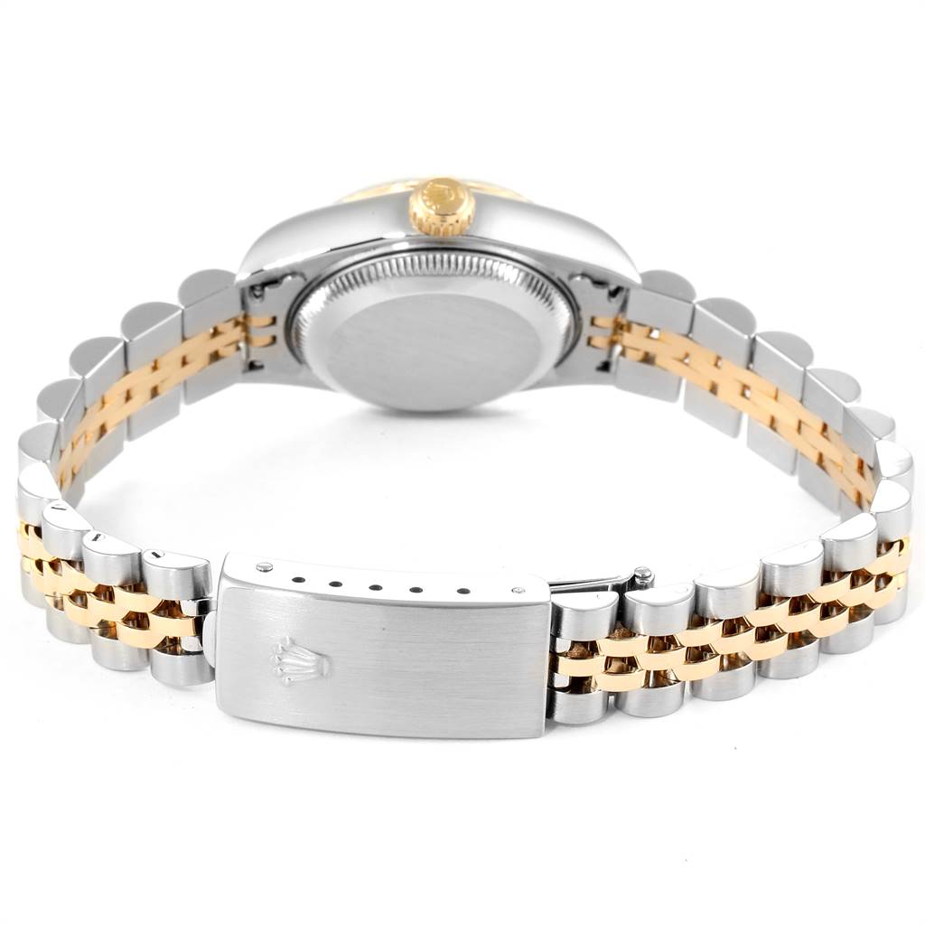 The image shows the back view of a Rolex Datejust 79173 Women's Steel and Gold (two tone) Champagne Dial 79173 Women's Steel and Gold (two tone) Champagne Dial watch, highlighting its case back, crown, and two-tone bracelet.