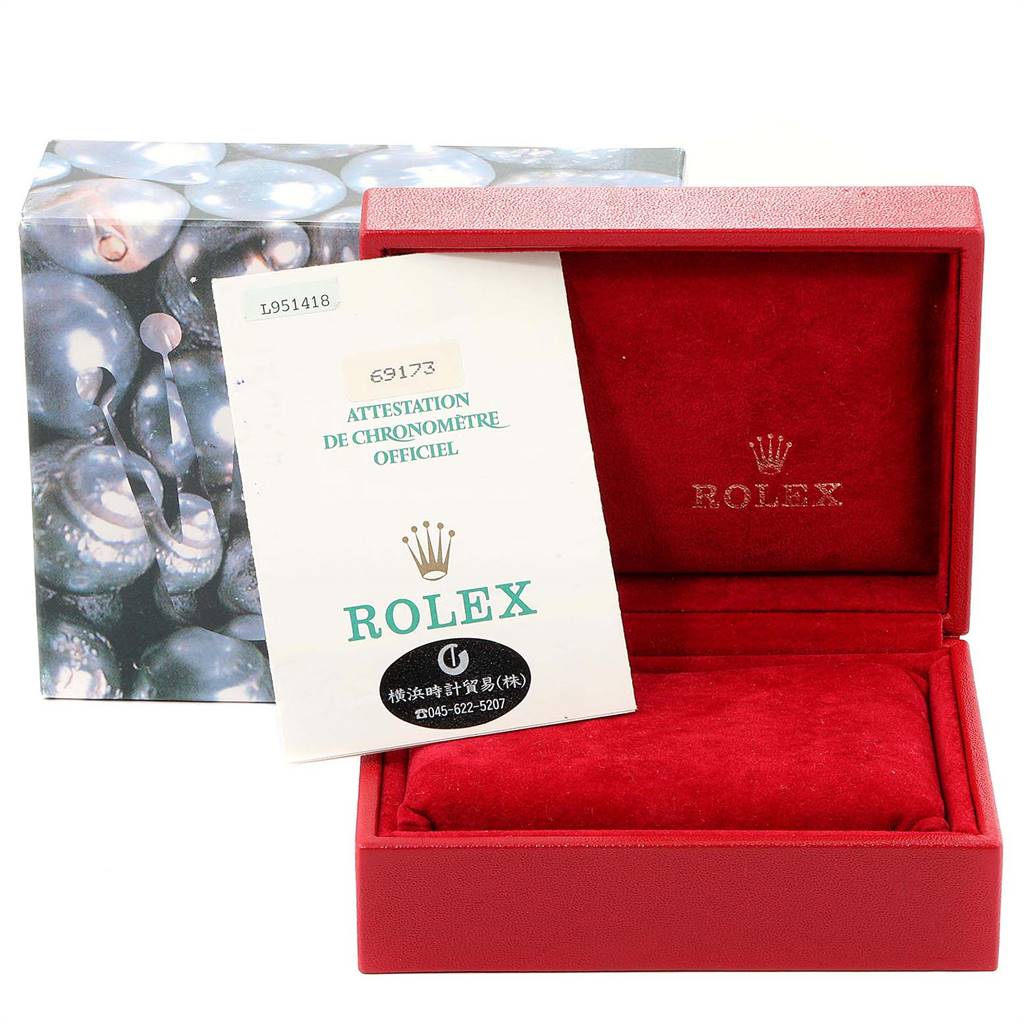 The image shows a Rolex Datejust 69173 Women's Stainless Steel Champagne Dial 69173 Women's Stainless Steel Champagne Dial box and an official chronometer certification document placed at an angle inside the open box.
