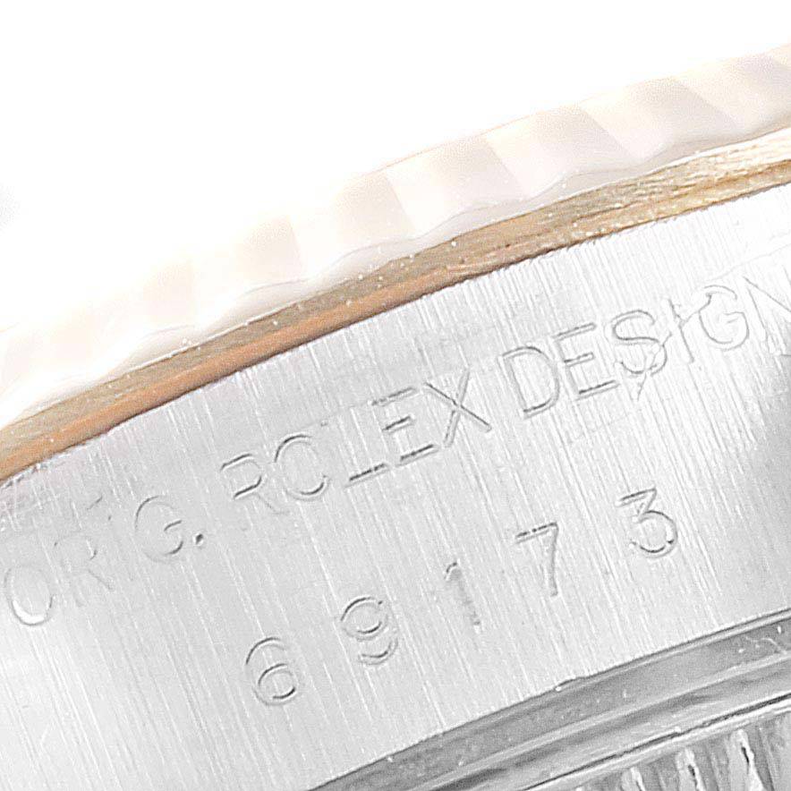 The image shows a close-up of the engraved casing of the Rolex Datejust 69173 Women's Stainless Steel Silver Dial 69173 Women's Stainless Steel Silver Dial model.