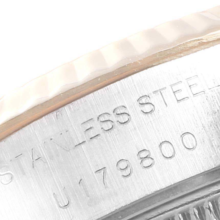 This close-up image shows the case edge and part of the fluted bezel of the Rolex Datejust 69173 Women's Stainless Steel Silver Dial 69173 Women's Stainless Steel Silver Dial watch, highlighting the engraved serial number and "STAINLESS STEEL."
