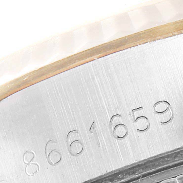 The image shows a close-up of the serial number engraved on the case of a Rolex Datejust 69173 Women's Stainless Steel White Dial 69173 Women's Stainless Steel White Dial watch.