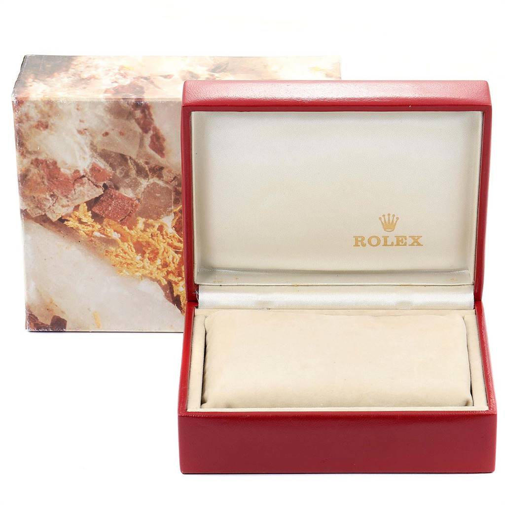 This image shows an empty Rolex Datejust 69173 Women's Stainless Steel White Dial 69173 Women's Stainless Steel White Dial watch box, open, with a beige cushion inside.
