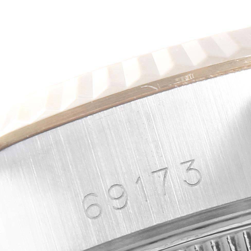 This close-up image shows the serial number engraved on the case side of a Rolex Datejust 69173 Women's Stainless Steel Champagne Dial 69173 Women's Stainless Steel Champagne Dial model.