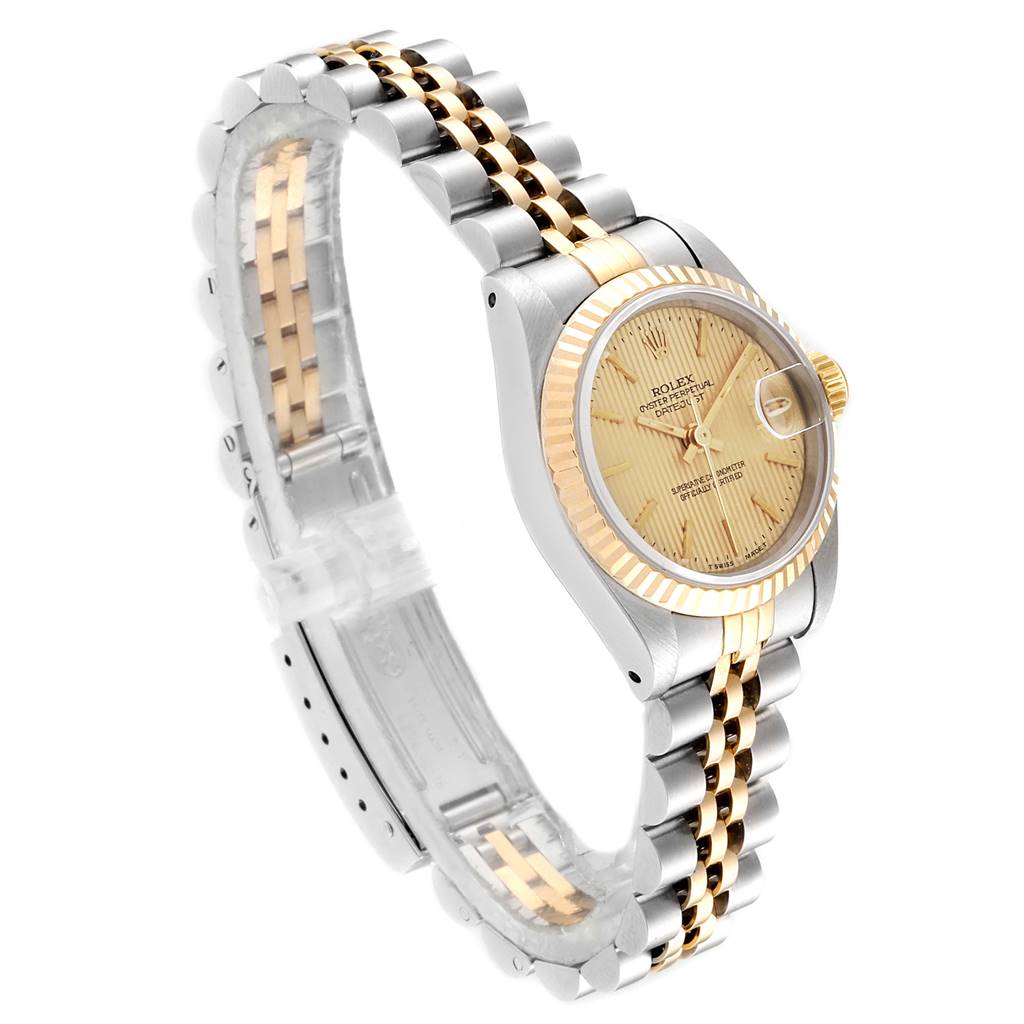 The Rolex Datejust 69173 Women's Stainless Steel Champagne Dial 69173 Women's Stainless Steel Champagne Dial watch is shown at an oblique angle, highlighting its two-tone bracelet, case, and gold-tone dial.