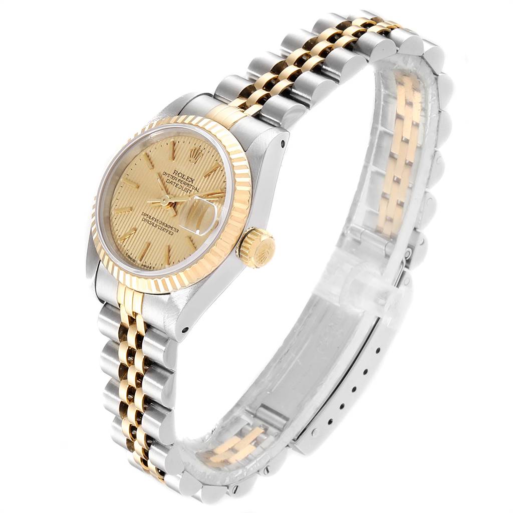 The image shows a side angle of a Rolex Datejust 69173 Women's Stainless Steel Champagne Dial 69173 Women's Stainless Steel Champagne Dial watch, highlighting its face, bezel, crown, and metal bracelet.