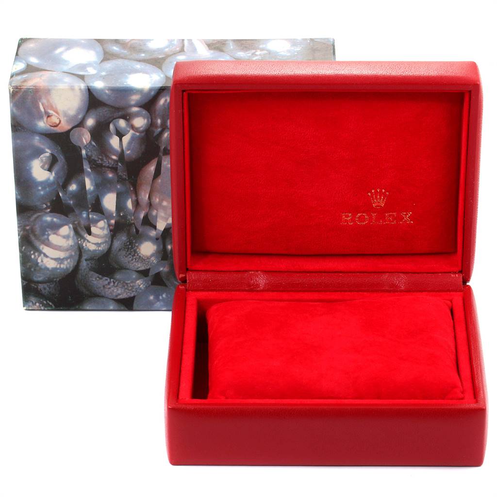 This image shows a red Rolex Datejust 69173 Women's Stainless Steel Champagne Dial 69173 Women's Stainless Steel Champagne Dial watch box with a cushion inside and an outer decorative box.