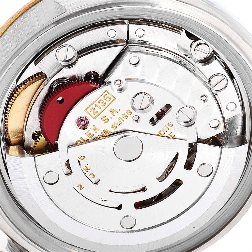 The image shows the internal mechanism of a Rolex Datejust 69173 Women's Stainless Steel Champagne Dial 69173 Women's Stainless Steel Champagne Dial watch, particularly the movement assembly and gears.
