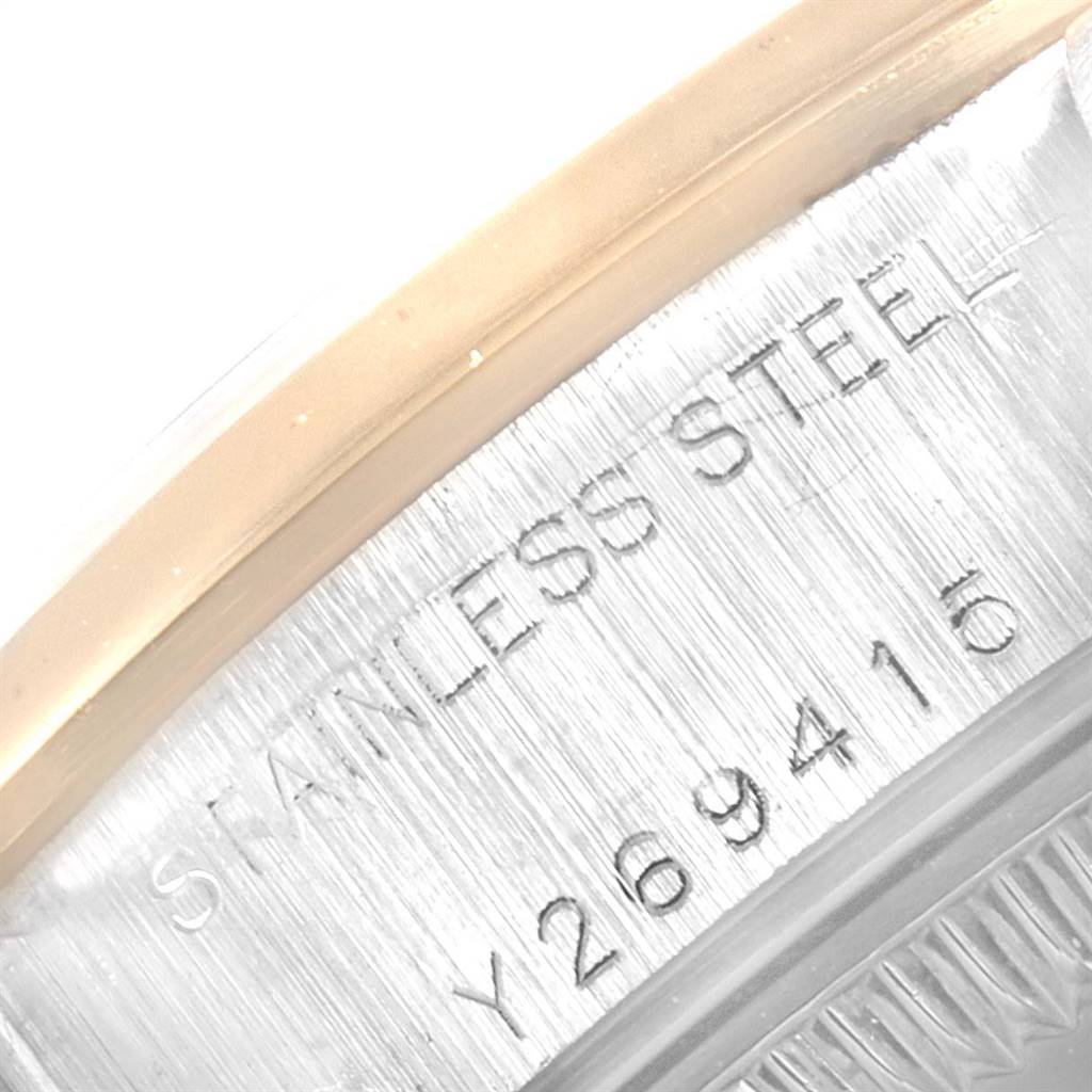 The image shows a close-up of the case edge detailing and serial number engraving of a Rolex Datejust 79163 Women's Steel and Gold (two tone) Champagne Dial 79163 Women's Steel and Gold (two tone) Champagne Dial watch.