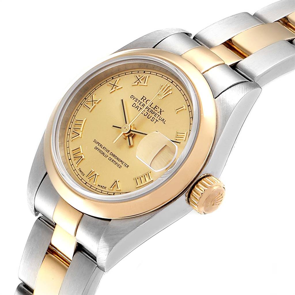 This image shows a Rolex Datejust 79163 Women's Steel and Gold (two tone) Champagne Dial 79163 Women's Steel and Gold (two tone) Champagne Dial watch at a slight angle, highlighting its dial, crown, and a portion of the bracelet.
