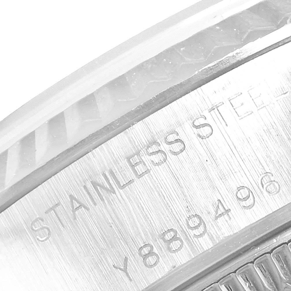 The image shows a close-up of the serial number and "STAINLESS STEEL" engraving on a Rolex Datejust 79174 Women
s Stainless Steel Silver Dial 79174 Women
s Stainless Steel Silver Dial watch.