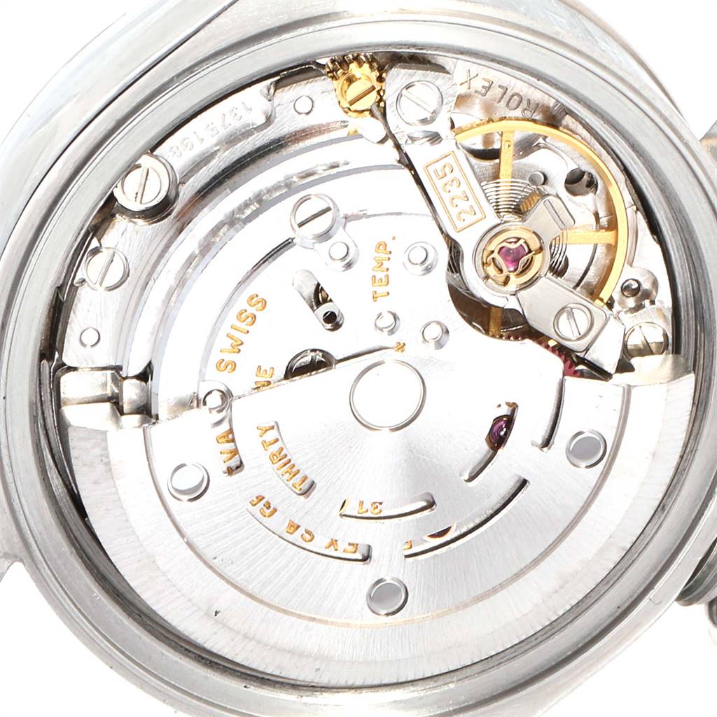 This close-up shows the internal mechanics of a Rolex Datejust 79174 Women
s Stainless Steel Silver Dial 79174 Women
s Stainless Steel Silver Dial watch, focusing on its movement and components.
