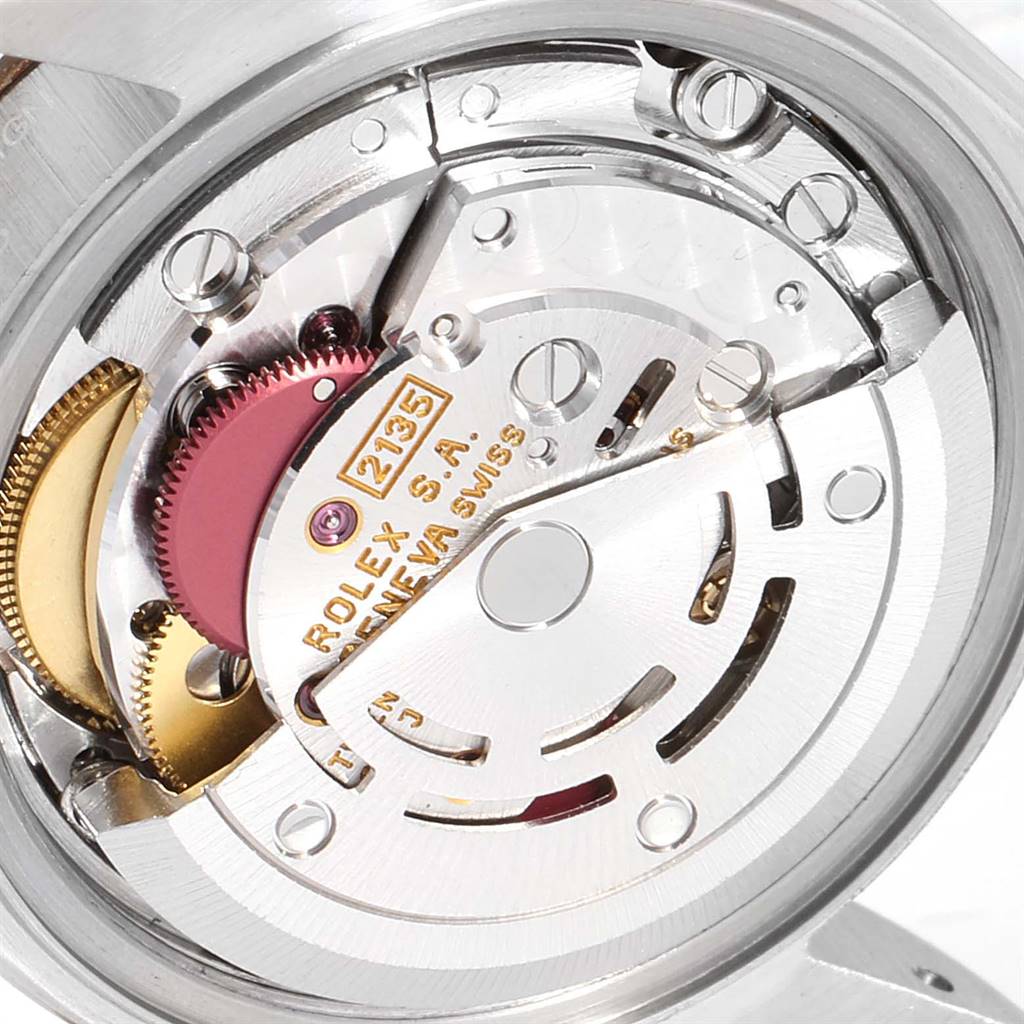 This close-up shot shows the intricate inner mechanics of a Rolex Datejust 69173 Women's Stainless Steel Champagne Dial 69173 Women's Stainless Steel Champagne Dial watch movement.