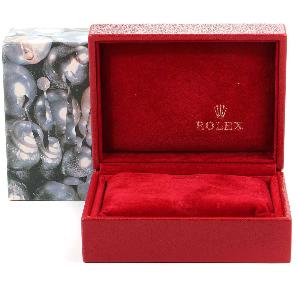 The image shows a red Rolex Datejust 69173 Women's Stainless Steel Champagne Dial 69173 Women's Stainless Steel Champagne Dial watch box with a textured cushion inside and a decorative outer box.