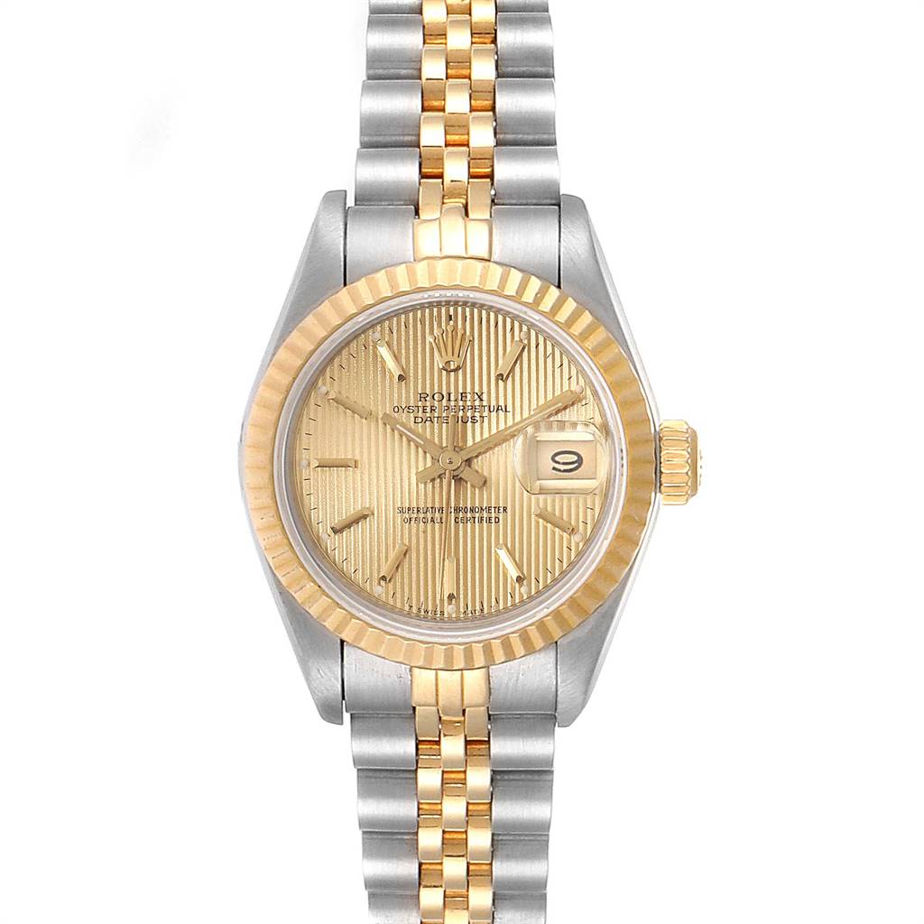 The Rolex Datejust 69173 Women
s Stainless Steel Champagne Dial 69173 Women
s Stainless Steel Champagne Dial watch is shown from a front angle, displaying its dial, fluted bezel, and two-tone bracelet.
