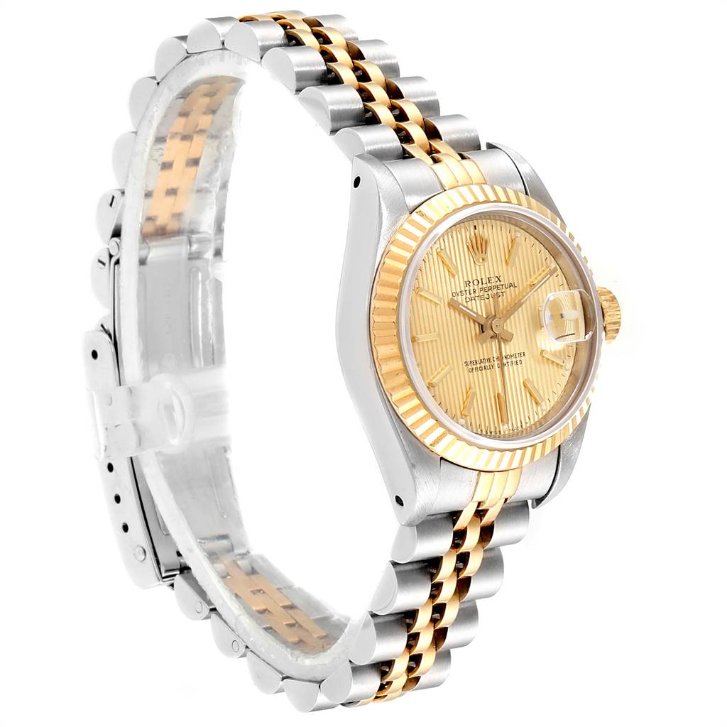 The image shows a side angle of the Rolex Datejust 69173 Women
s Stainless Steel Champagne Dial 69173 Women
s Stainless Steel Champagne Dial watch, highlighting the face, bezel, crown, and a part of the bracelet.
