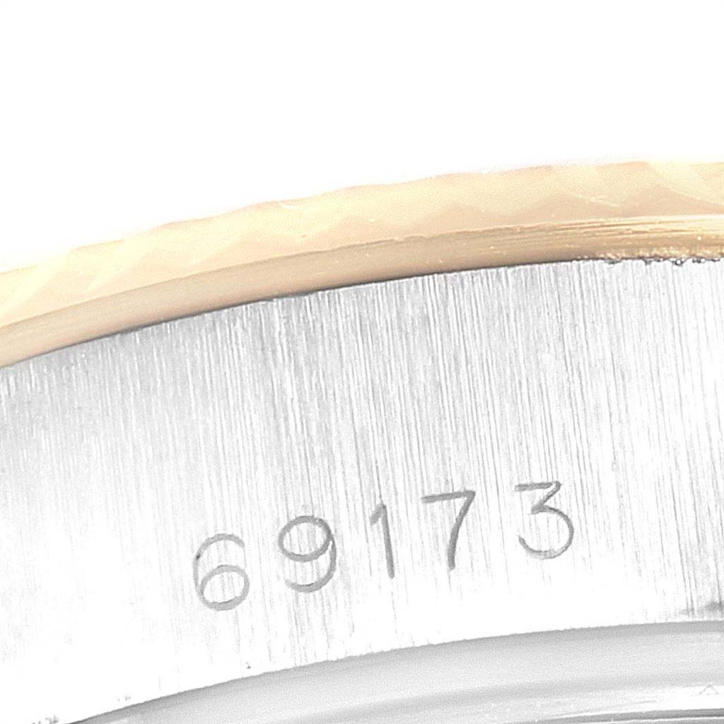 The image shows the case side of a Rolex Datejust 69173 Women
s Stainless Steel Blue Dial 69173 Women
s Stainless Steel Blue Dial watch, including part of the bezel and the reference number 69173.