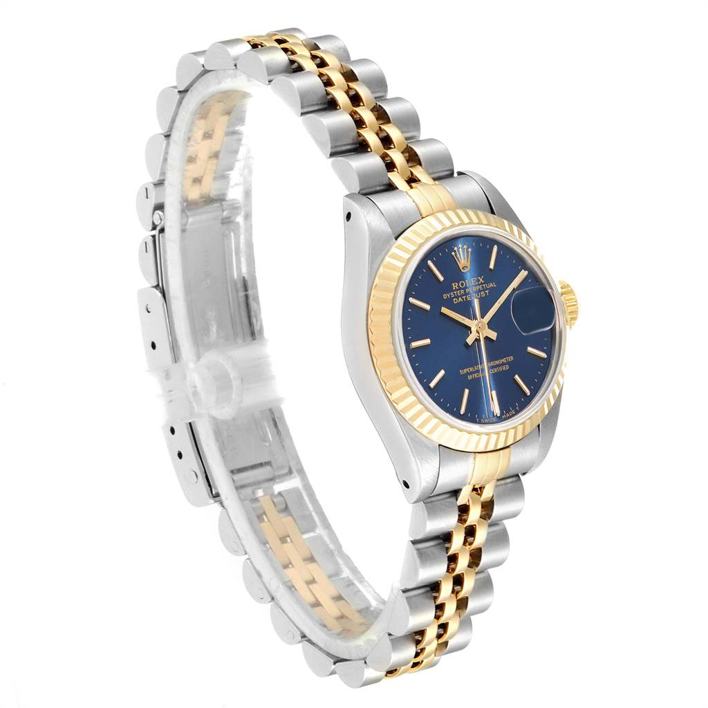 This image shows a Rolex Datejust 69173 Women
s Stainless Steel Blue Dial 69173 Women
s Stainless Steel Blue Dial watch at a three-quarter angle, highlighting its blue dial, two-tone bracelet, and fluted bezel.