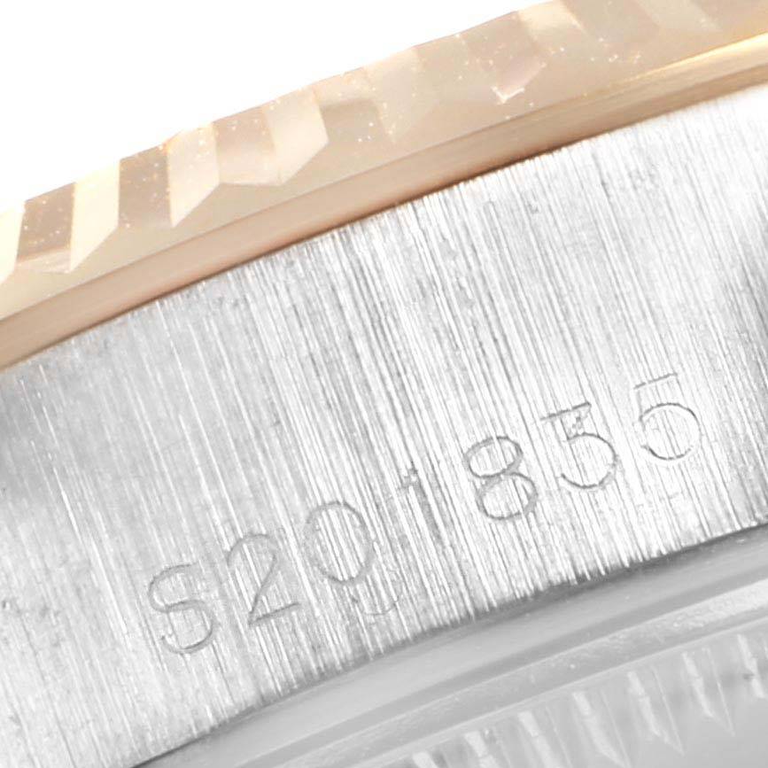 The image shows a close-up of the serial number engraved on the side of the bezel of the Rolex Datejust 69173 Women
s Stainless Steel Blue Dial 69173 Women
s Stainless Steel Blue Dial model.