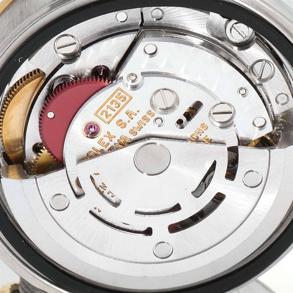 This image shows a close-up of the movement mechanism inside a Rolex Datejust 69173 Women
s Stainless Steel Blue Dial 69173 Women
s Stainless Steel Blue Dial watch.