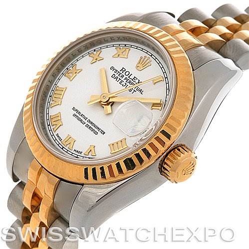 This image shows a Rolex Datejust 179173 Women's Steel and Gold (two tone) White Dial 179173 Women's Steel and Gold (two tone) White Dial watch at an angle highlighting its dial, bezel, crown, and bracelet.