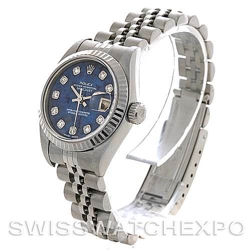 This image shows a side view of a Rolex Datejust 79174 Women's Stainless Steel Blue Dial 79174 Women's Stainless Steel Blue Dial watch, highlighting its bracelet, crown, and blue dial with diamond markers.