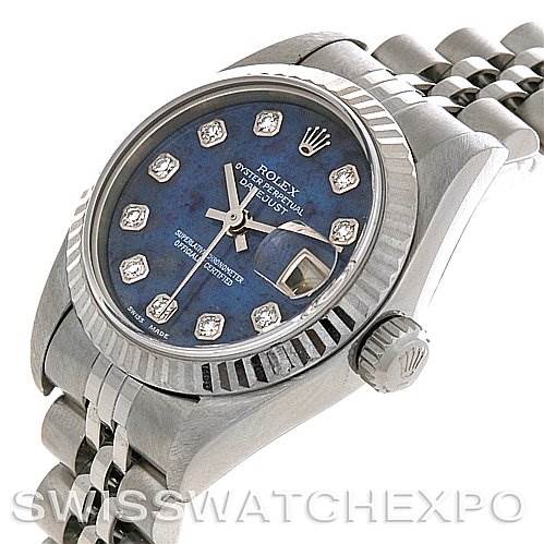 The image shows a Rolex Datejust 79174 Women's Stainless Steel Blue Dial 79174 Women's Stainless Steel Blue Dial watch at a slight angle, focusing on its blue dial, bezel, crown, and part of the bracelet.