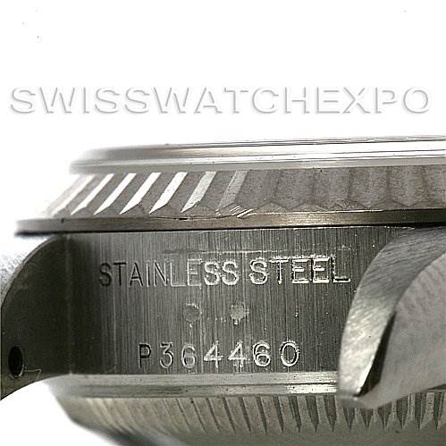 This is a close-up side angle showing the case and bezel of a Rolex Datejust 79174 Women's Stainless Steel Blue Dial 79174 Women's Stainless Steel Blue Dial watch, highlighting its stainless steel engravings.