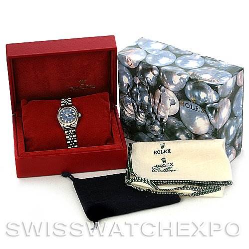 This image shows a Rolex Datejust 79174 Women's Stainless Steel Blue Dial 79174 Women's Stainless Steel Blue Dial watch in its open red box, accompanied by a branded outer box and cleaning cloths.
