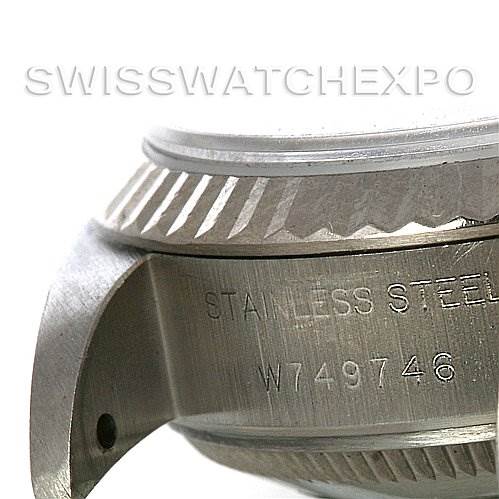 The image shows a side view of the case and bezel of a Rolex Datejust 69174 Women's Stainless Steel Black Dial 69174 Women's Stainless Steel Black Dial, highlighting the stainless steel material and serial number.