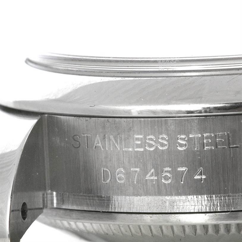 The image shows a close-up of the caseback and the serial number engraving on a Rolex Datejust 179160 Women's Stainless Steel Pink Dial 179160 Women's Stainless Steel Pink Dial watch.