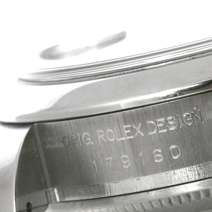 The image shows the engraved serial number and "ORIG. ROLEX DESIGN" text on the case side of a Rolex Datejust 179160 Women's Stainless Steel Pink Dial 179160 Women's Stainless Steel Pink Dial watch.