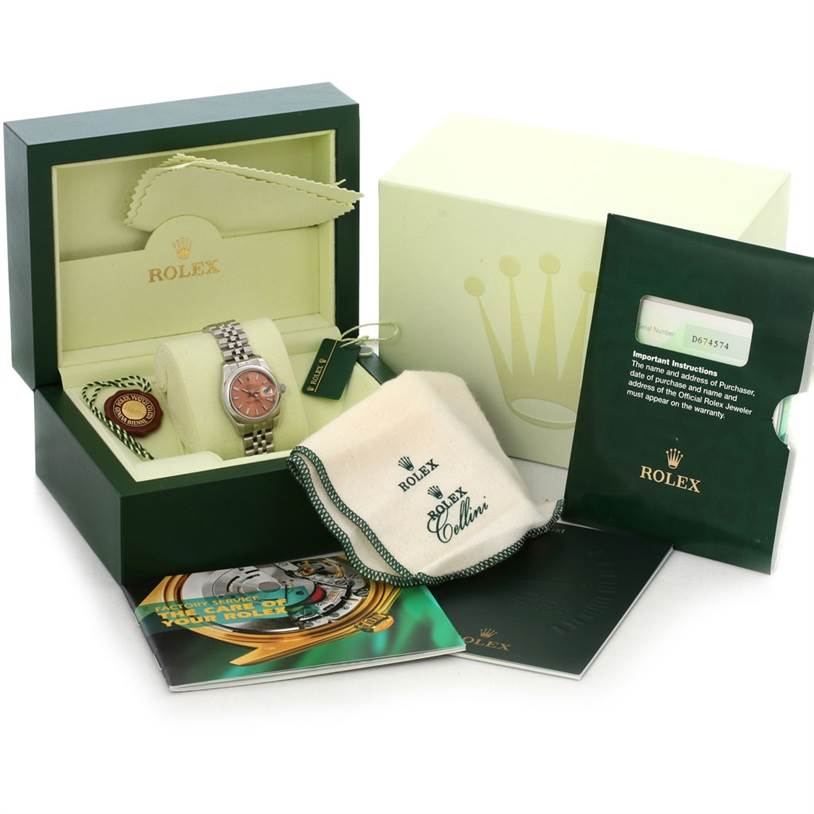 The image shows a complete set of a Rolex Datejust 179160 Women's Stainless Steel Pink Dial 179160 Women's Stainless Steel Pink Dial watch, including the watch, box, warranty card, cleaning cloth, and manuals.