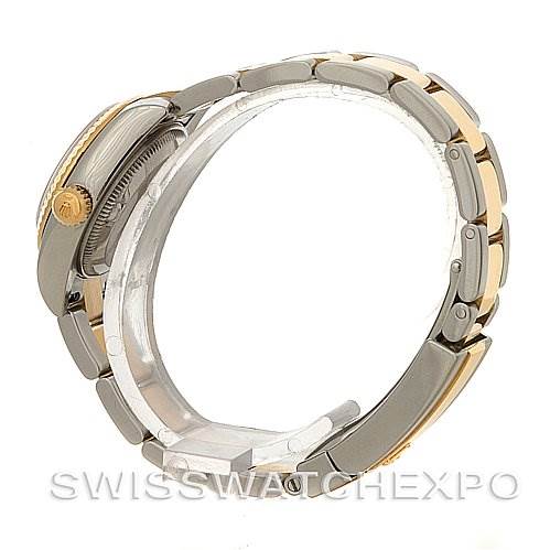 This image shows a side view of the Rolex Datejust 179173 Women's Steel and Gold (two tone) Champagne Dial 179173 Women's Steel and Gold (two tone) Champagne Dial watch, highlighting the crown and the two-tone bracelet.