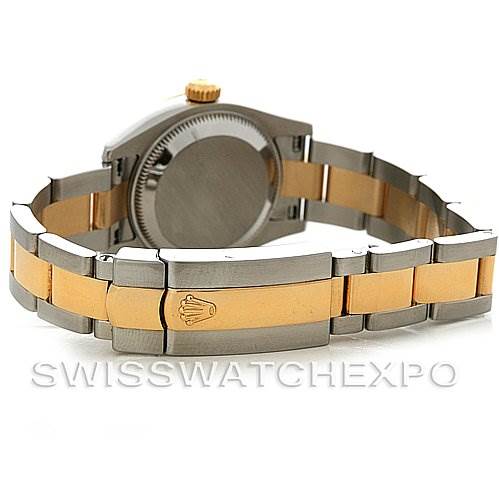 The image shows the back and bracelet of a Rolex Datejust 179173 Women's Steel and Gold (two tone) Champagne Dial 179173 Women's Steel and Gold (two tone) Champagne Dial watch, highlighting its two-tone metal design and clasp with the Rolex logo.