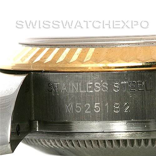 This image shows the side view of the bezel and case of a Rolex Datejust 179173 Women's Steel and Gold (two tone) Champagne Dial 179173 Women's Steel and Gold (two tone) Champagne Dial watch, including the engraving "STAINLESS STEEL" and a serial number.