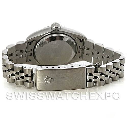 The image shows the back of a Rolex Datejust 79174 Women's Stainless Steel Mother of Pearl Dial 79174 Women's Stainless Steel Mother of Pearl Dial model watch, focusing on the case back, crown, and Jubilee bracelet with the clasp.