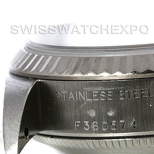 This image shows a close-up of the bezel, part of the case, and serial number engraving of a Rolex Datejust 79174 Women's Stainless Steel Mother of Pearl Dial 79174 Women's Stainless Steel Mother of Pearl Dial watch.