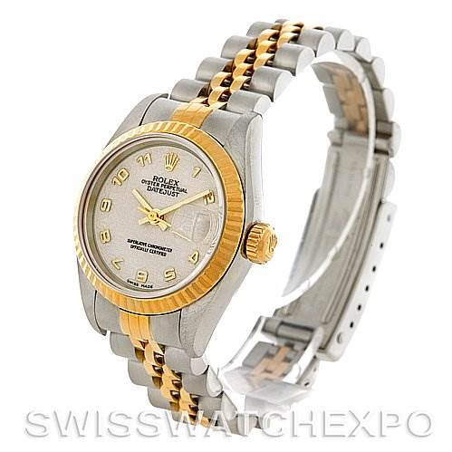 The image shows a side-angle view of a Rolex Datejust 69173 Women's Stainless Steel Beige Dial 69173 Women's Stainless Steel Beige Dial watch, highlighting its face, bezel, crown, and part of the bracelet.