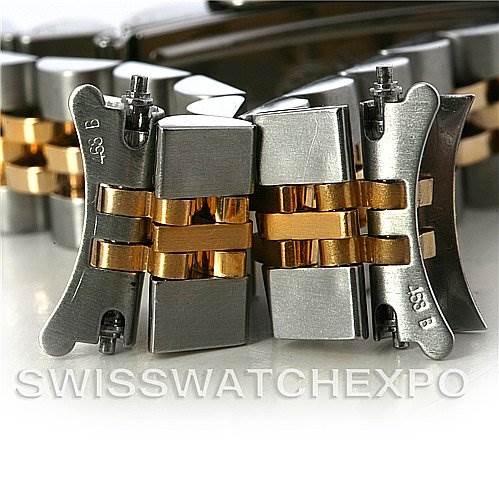 This image shows a close-up of the bracelet links of a Rolex Datejust 69173 Women's Stainless Steel Beige Dial 69173 Women's Stainless Steel Beige Dial watch, featuring both steel and gold components.